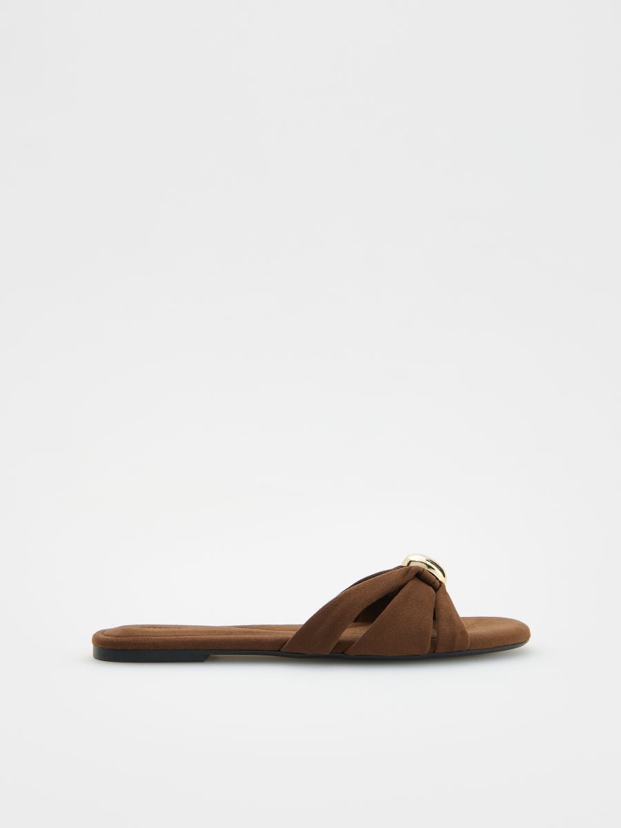 Sliders with decorative buckle