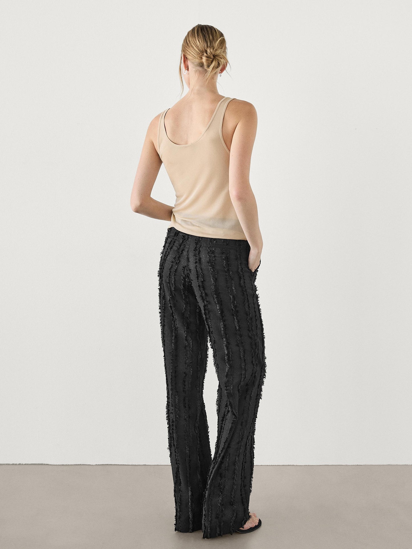 Trousers with fringe detail