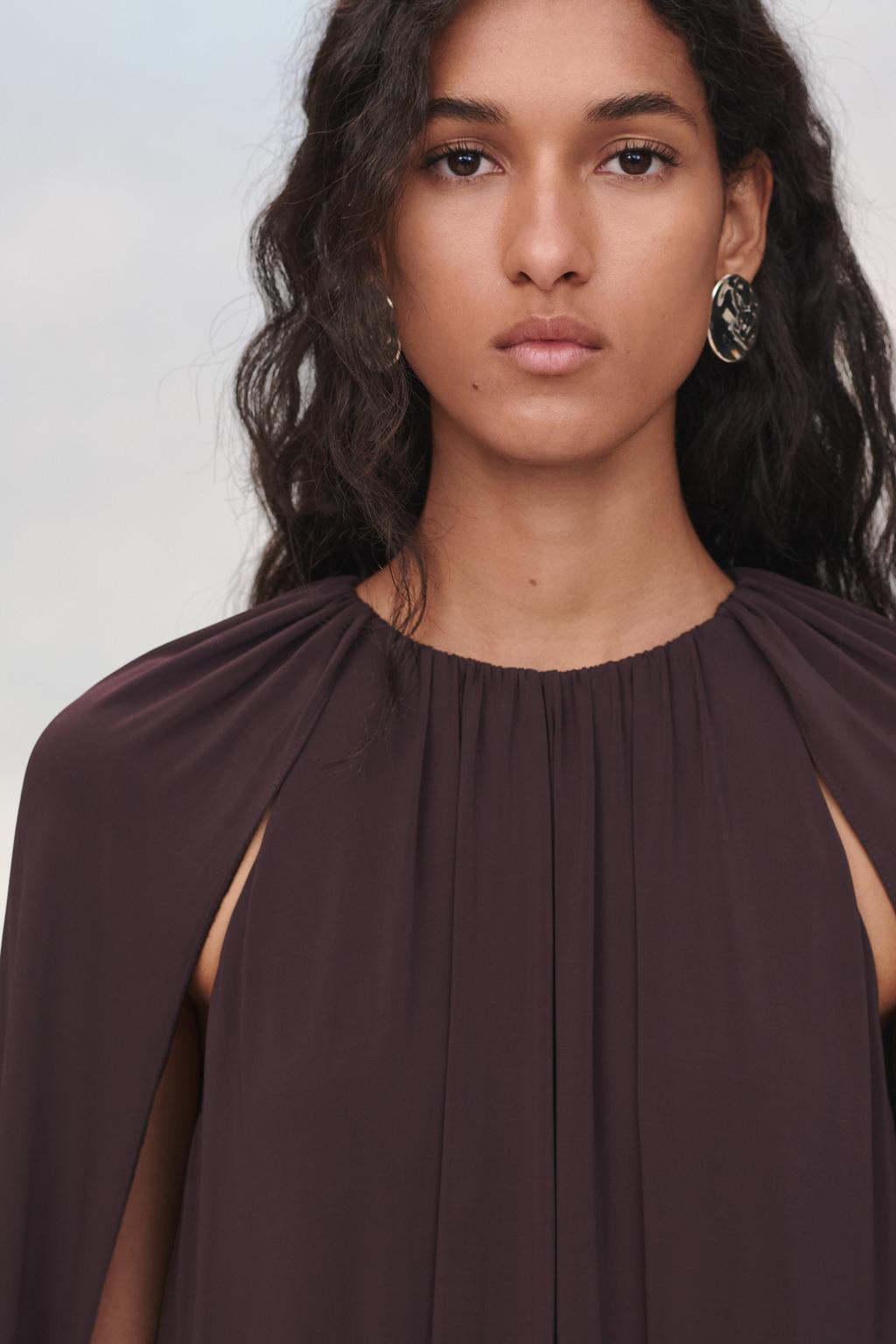 Limited edition cape dress with belt