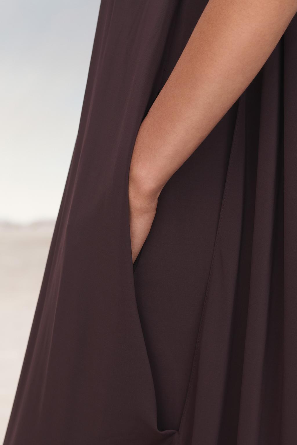 Limited edition cape dress with belt