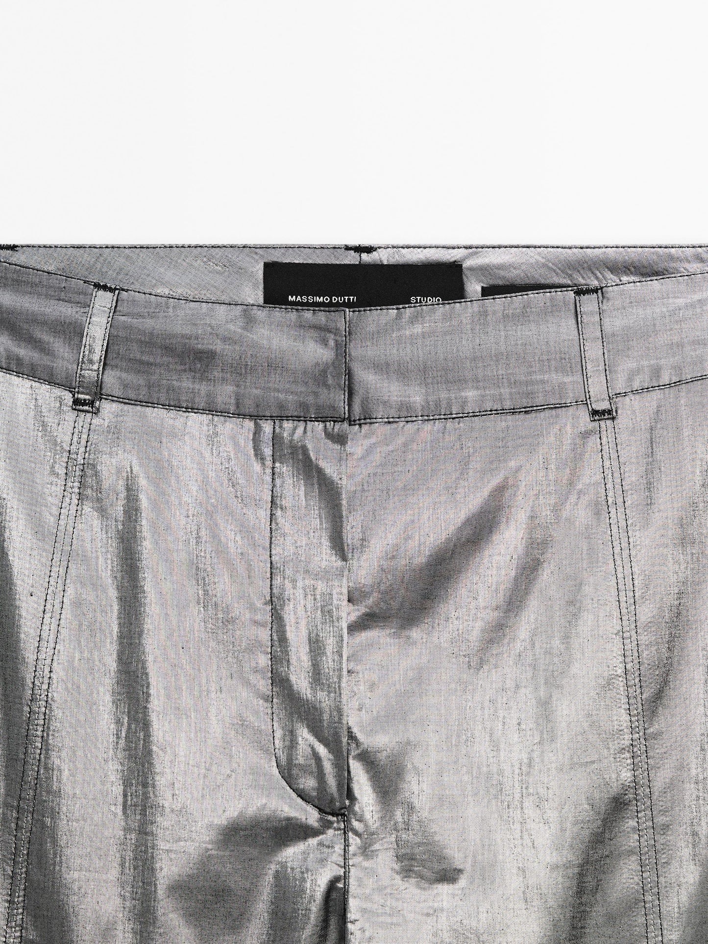 Shiny trousers with seams