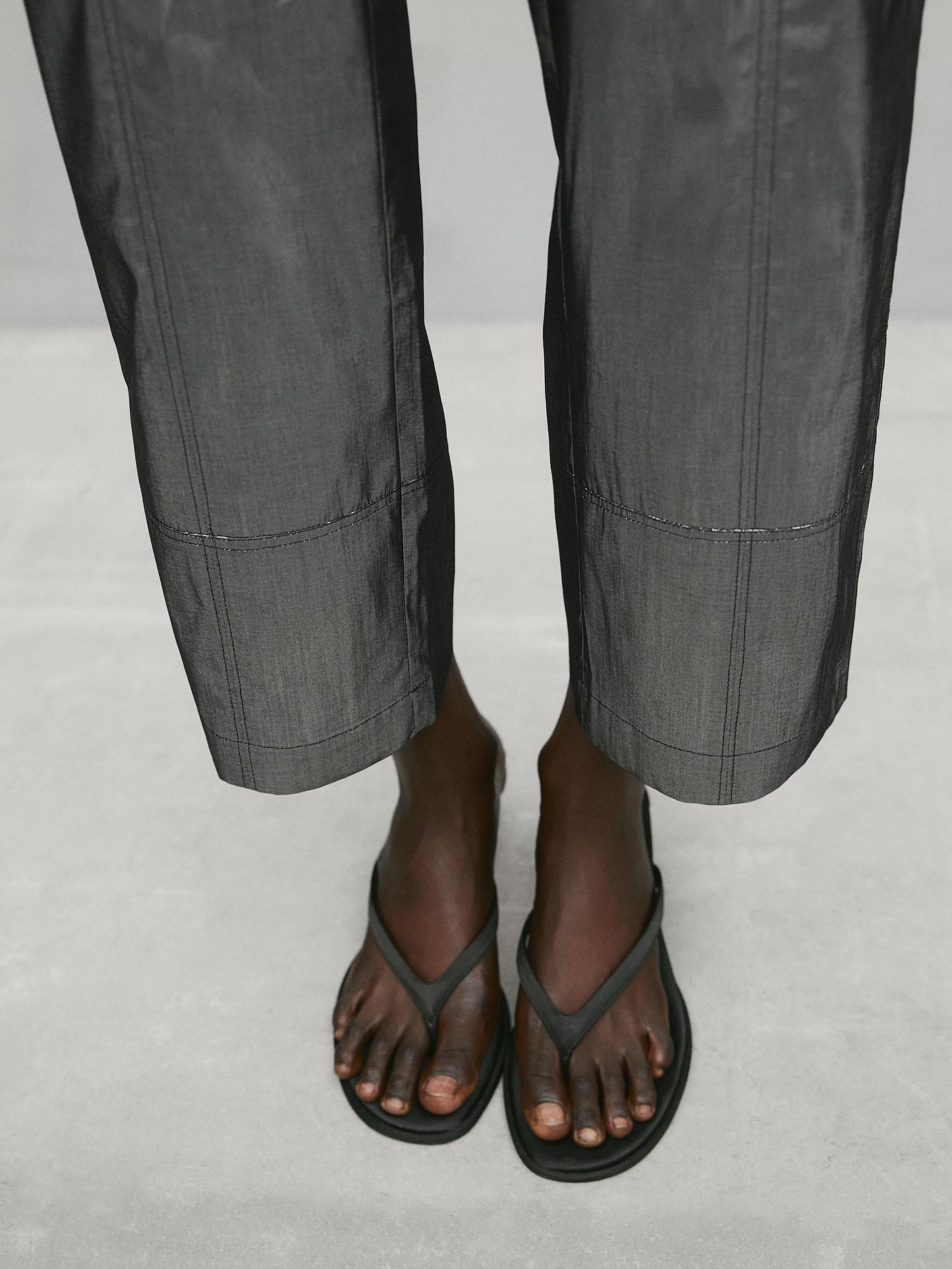 Shiny trousers with seams