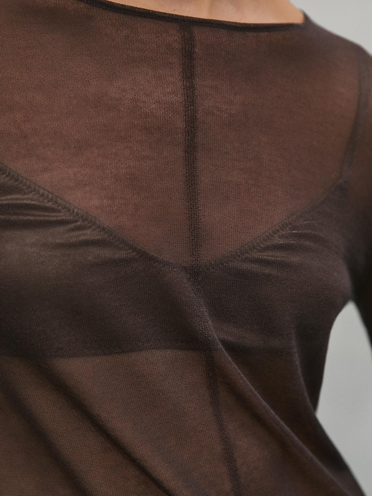 Semi-sheer sweater with seam detail