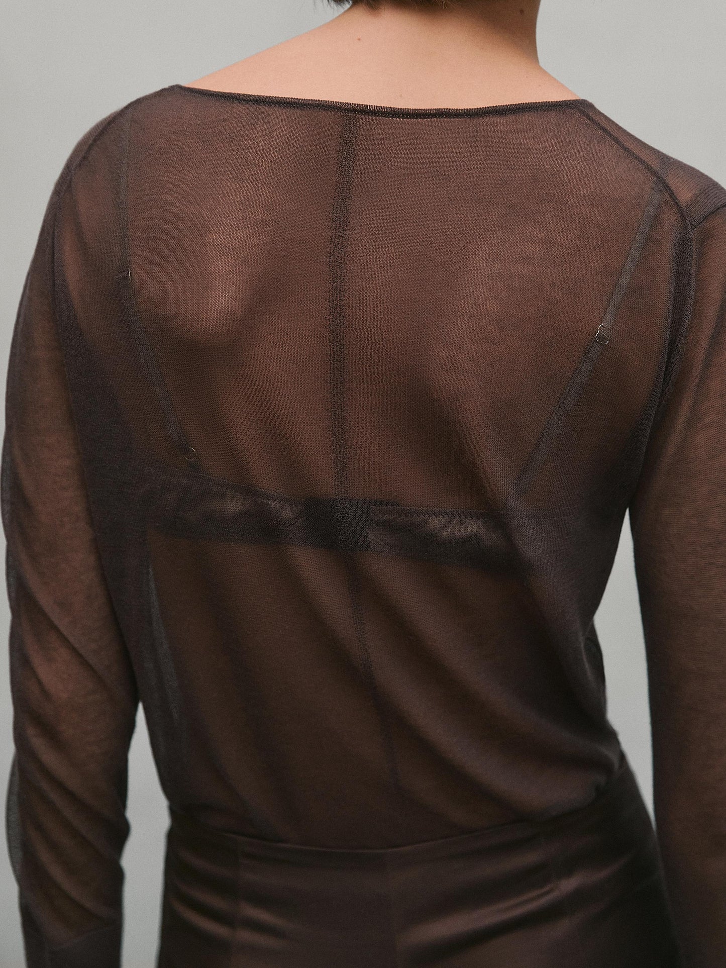 Semi-sheer sweater with seam detail