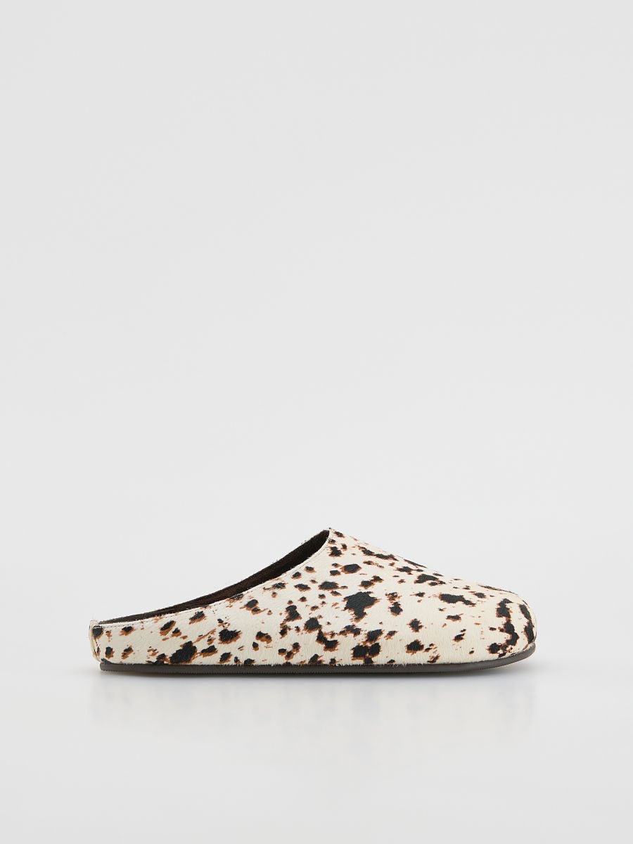 Leather mules with animal motif