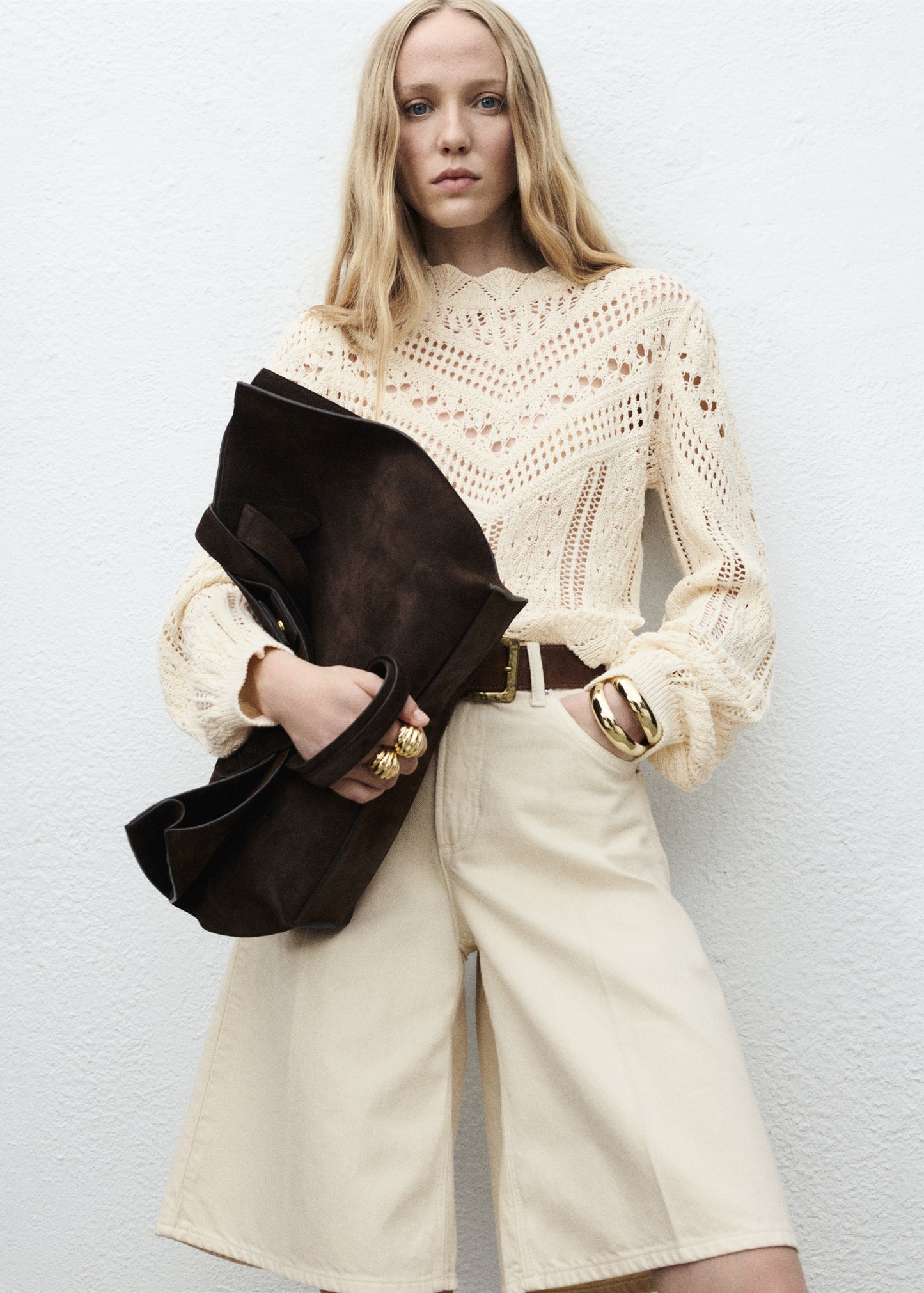 Knitted sweater with openwork details