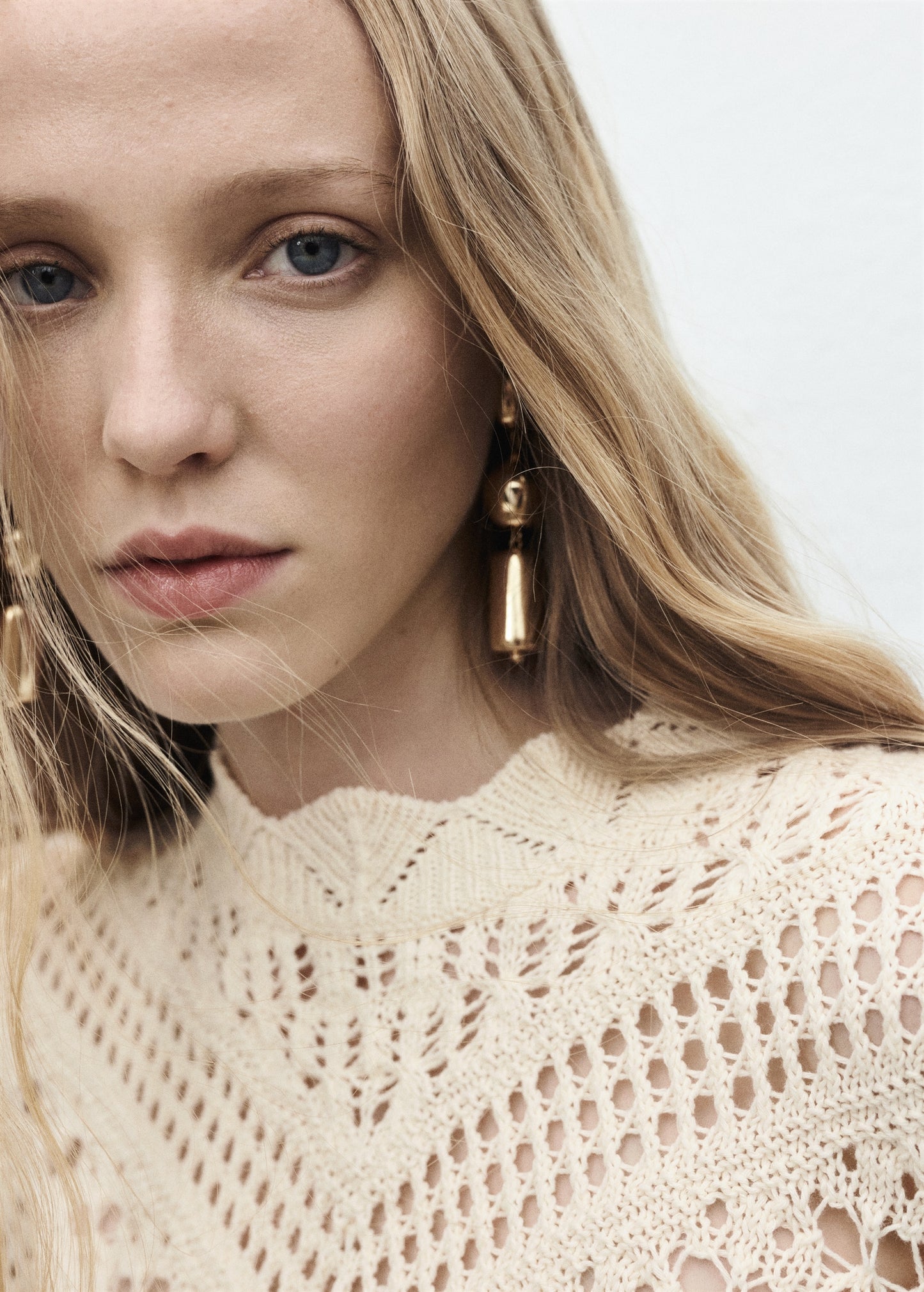 Knitted sweater with openwork details