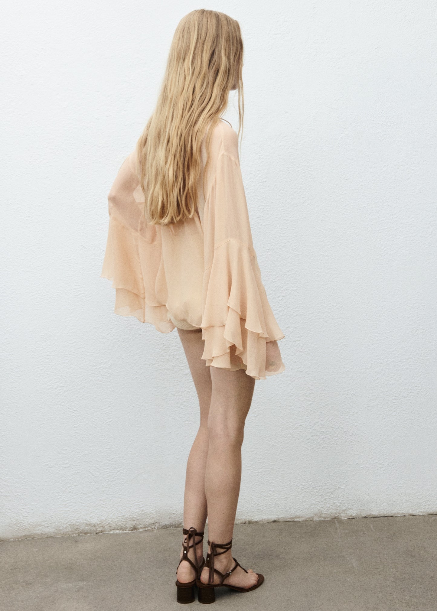 Ruffled blouse with flared sleeves