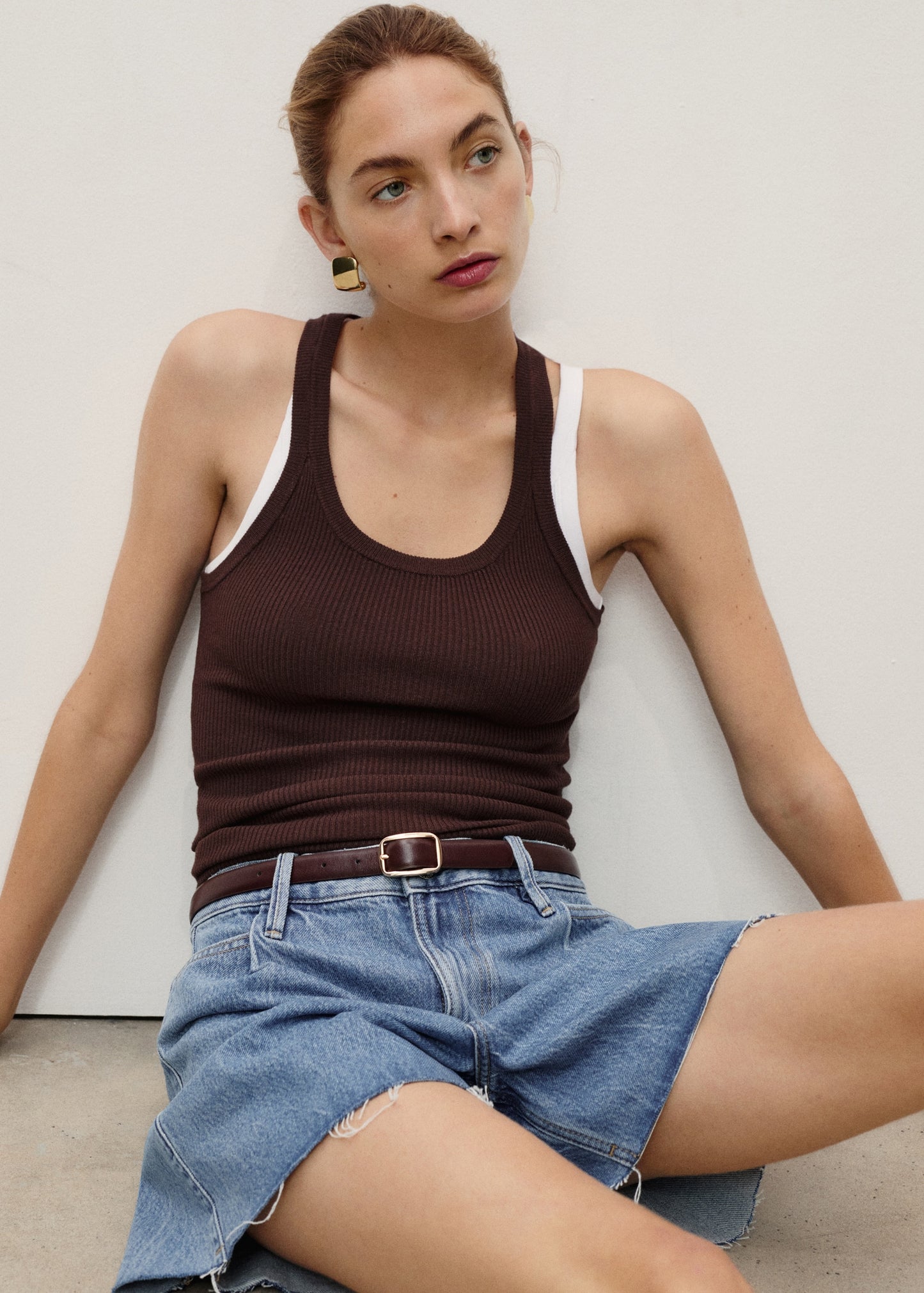 Denim shorts with frayed hem and pleats