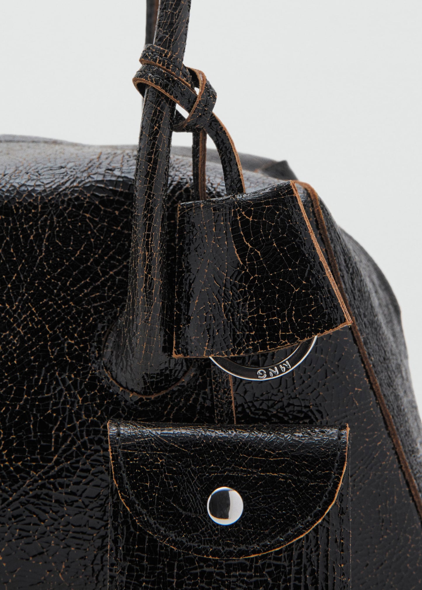 Leather shoulder bag with charms