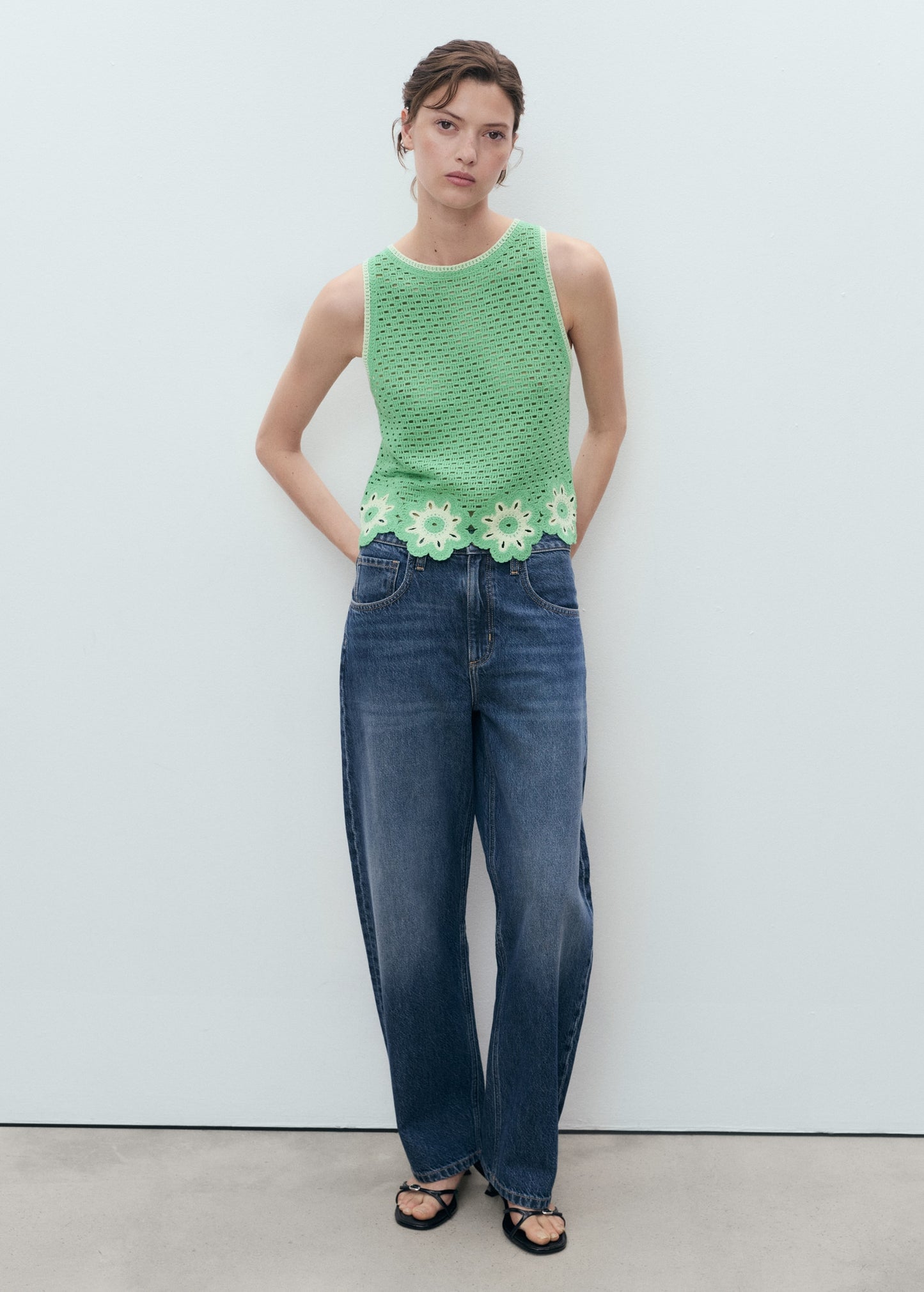 Crochet top with floral finishes