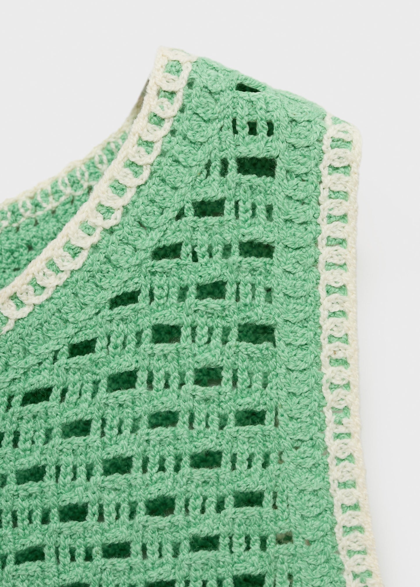 Crochet top with floral finishes