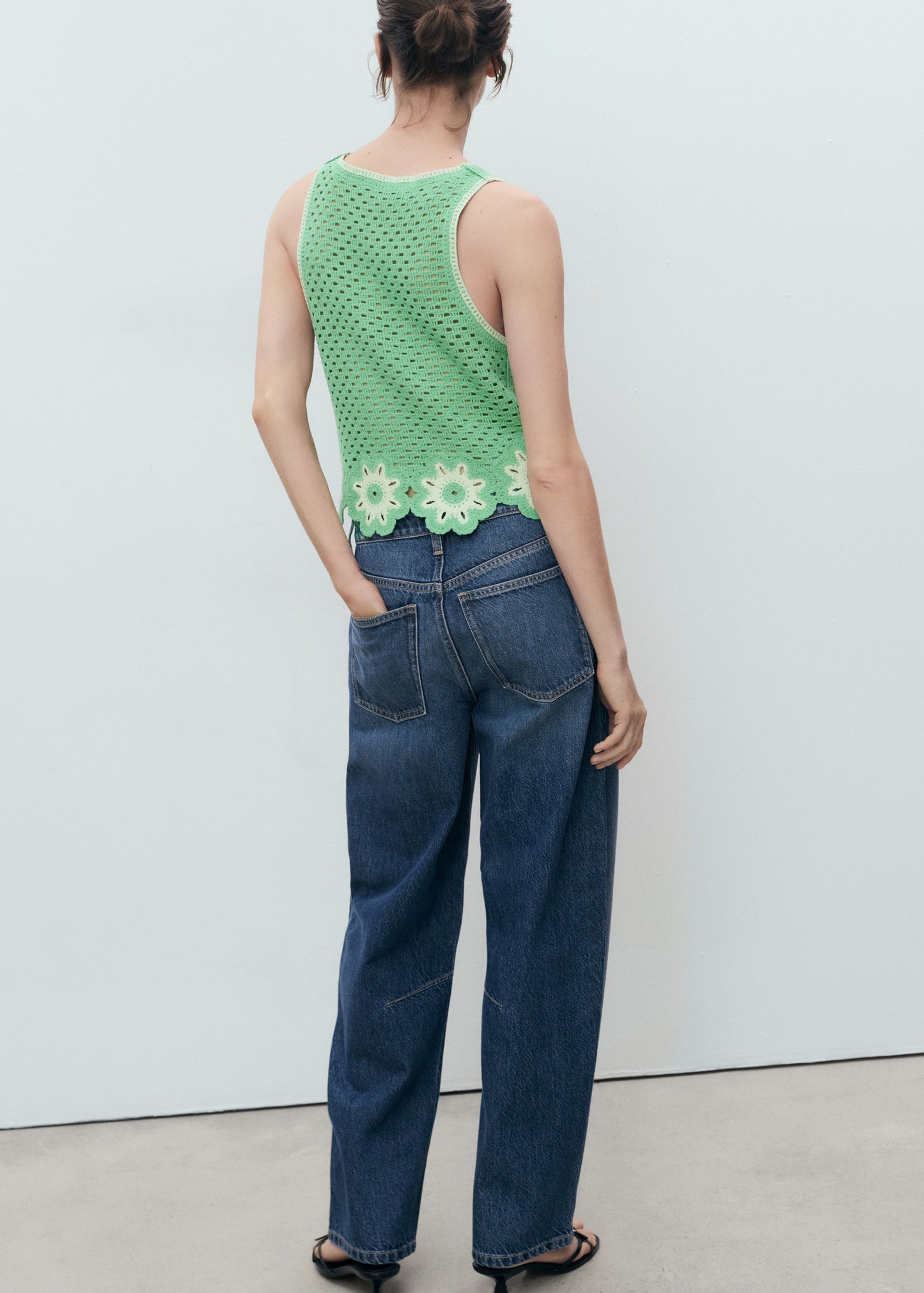 Crochet top with floral finishes
