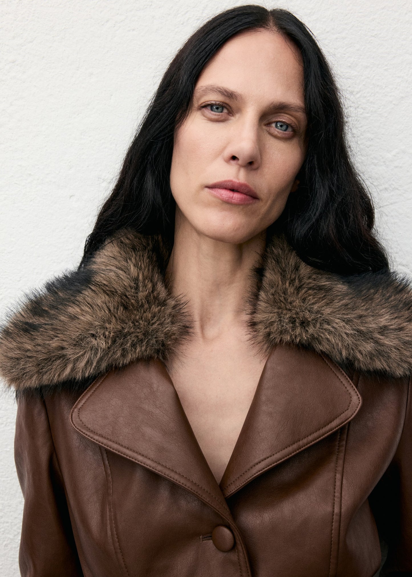 Leather-effect coat with fur collar