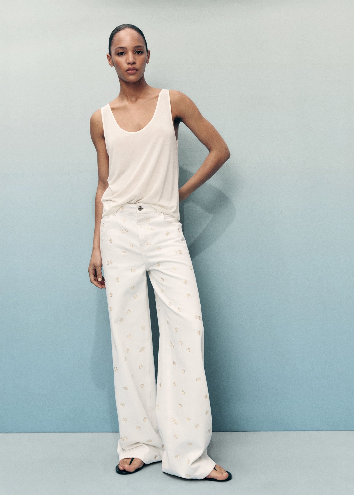 Flower-embroidered wide-leg jeans