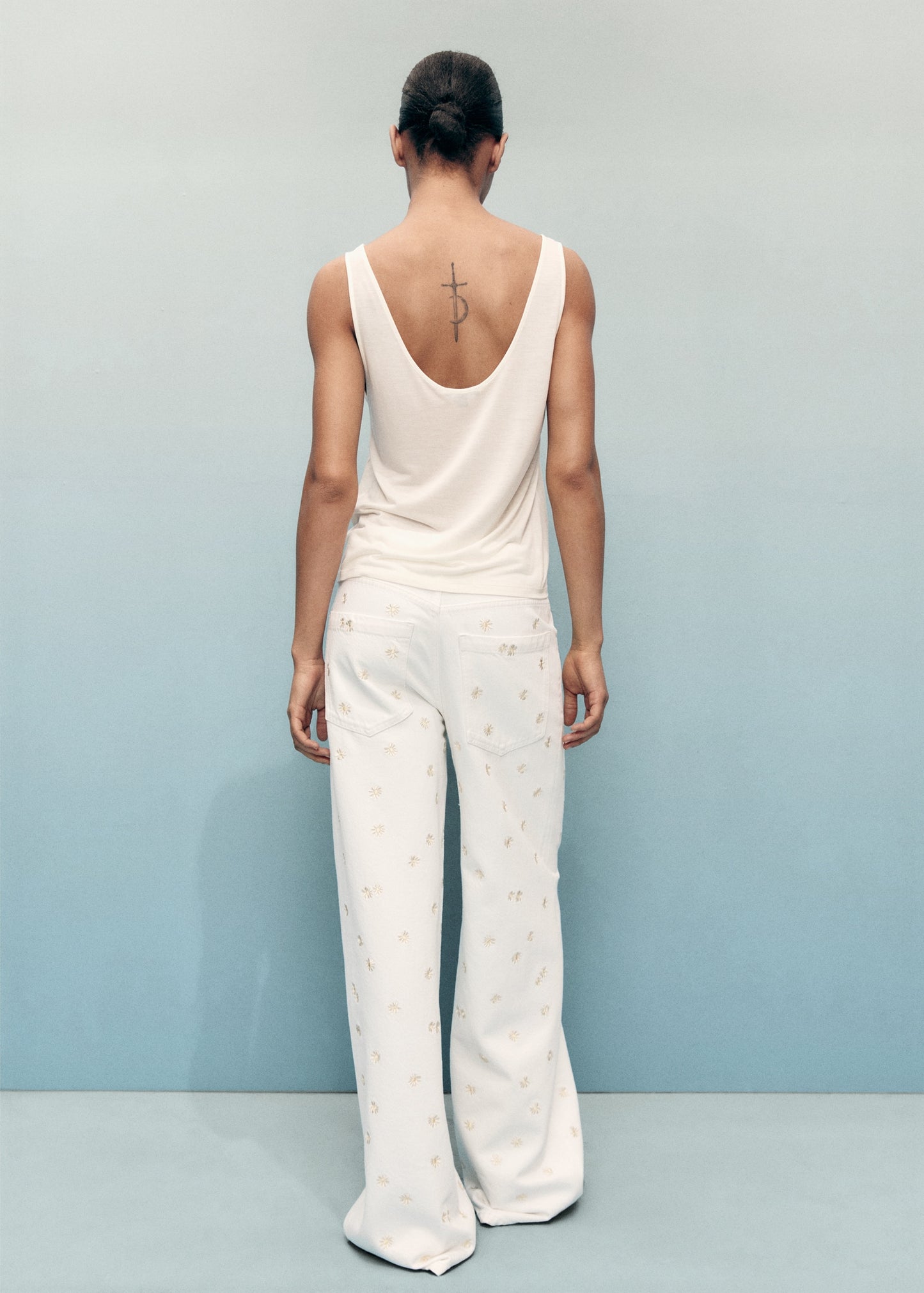 Flower-embroidered wide-leg jeans