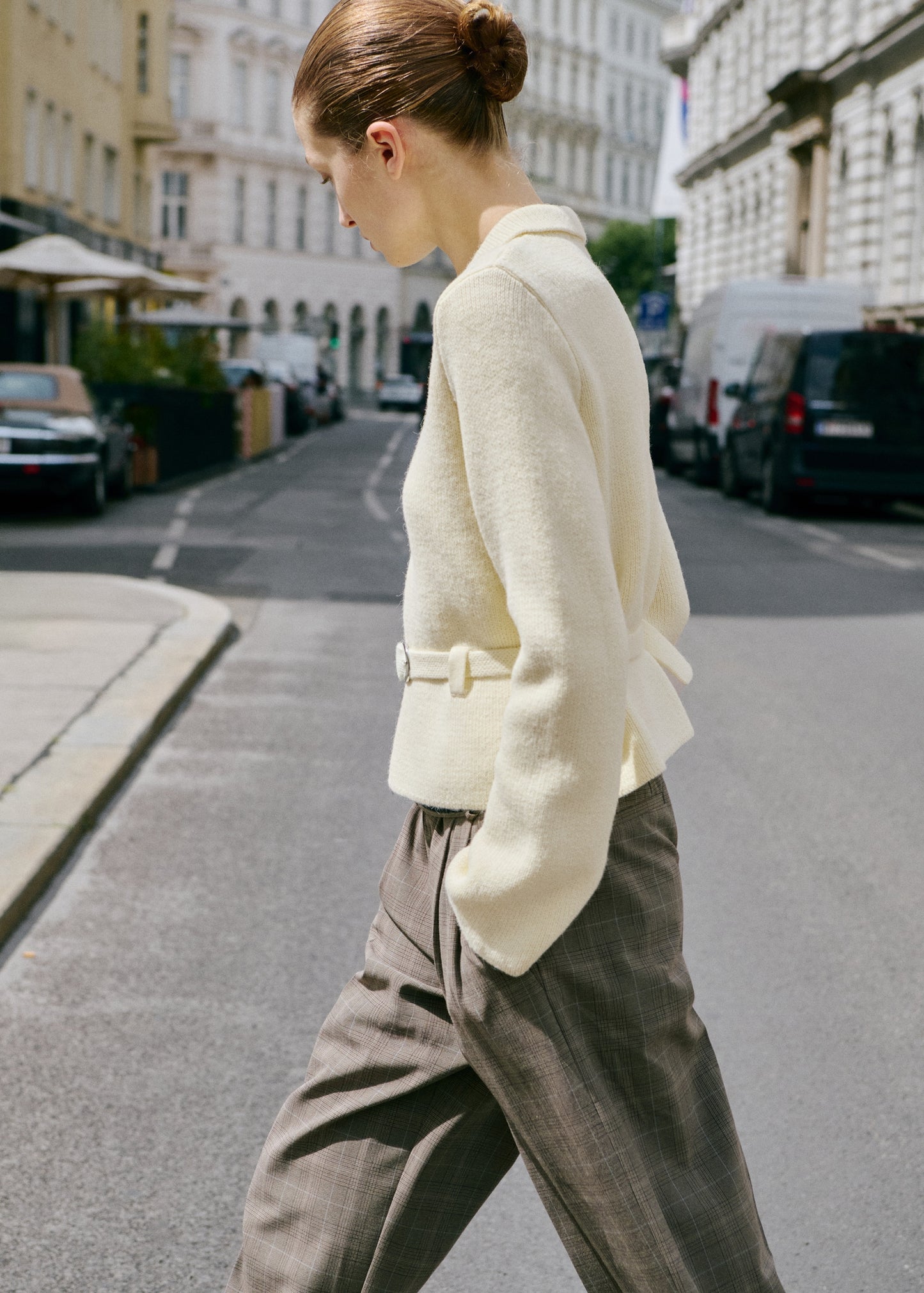Knitted jacket with belt buckle