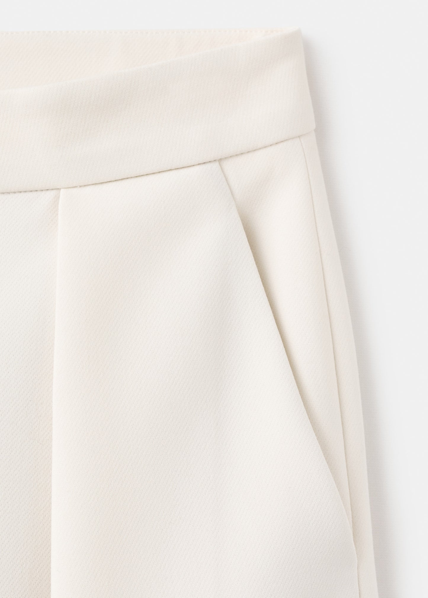 Pleated trousers with zip