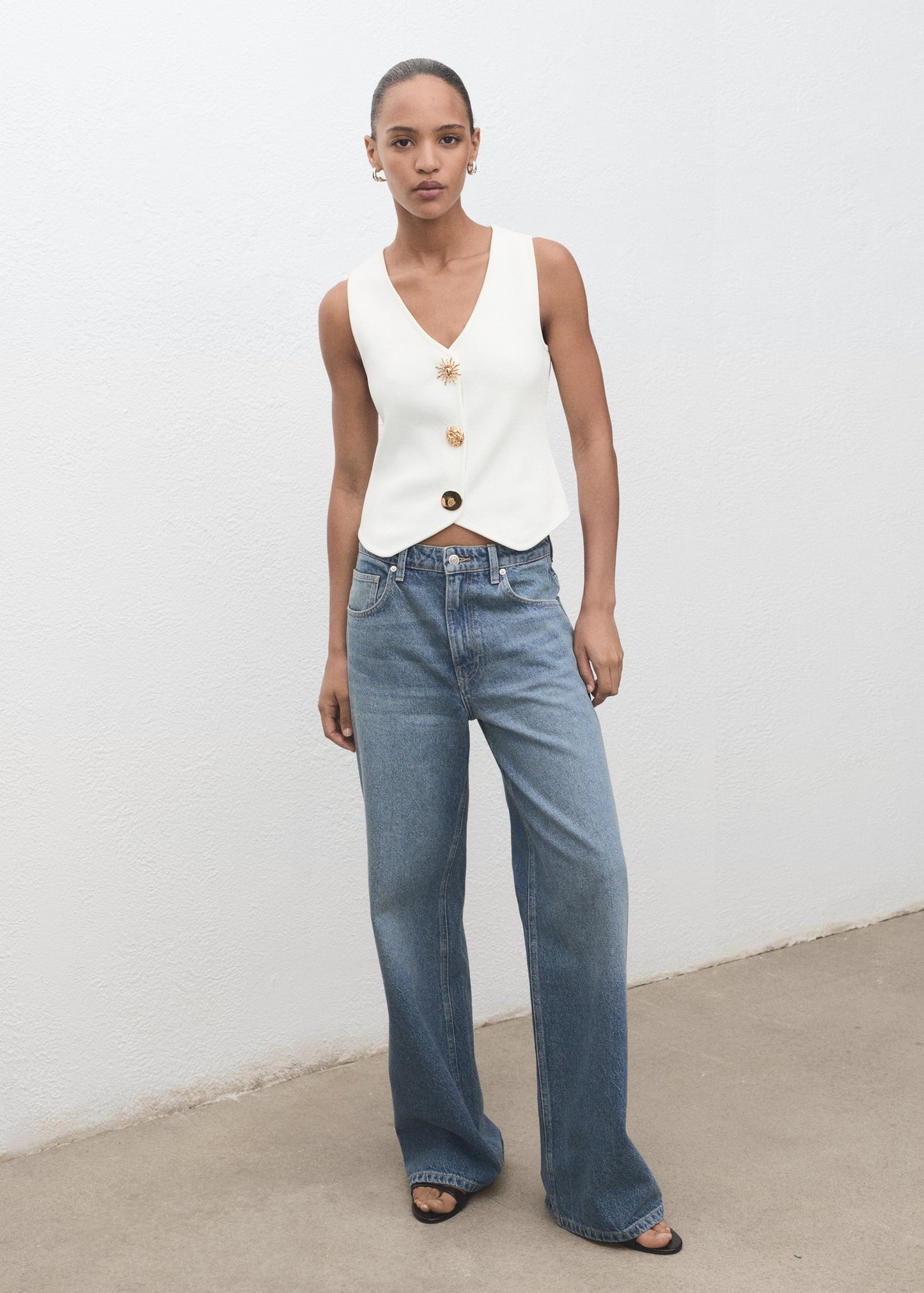 Knitted waistcoat with jewel buttons