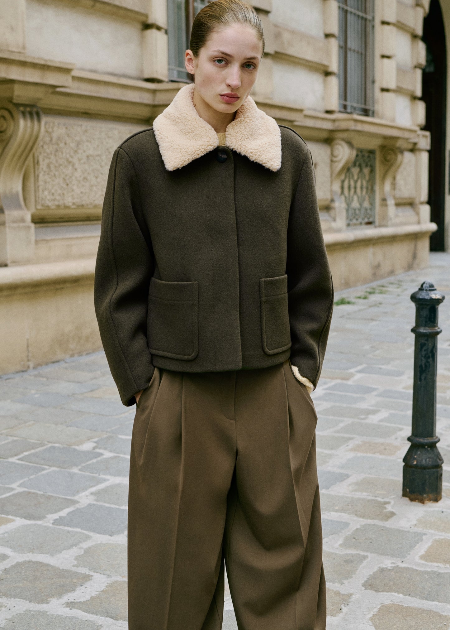 Wide-leg mid-rise pleated trousers