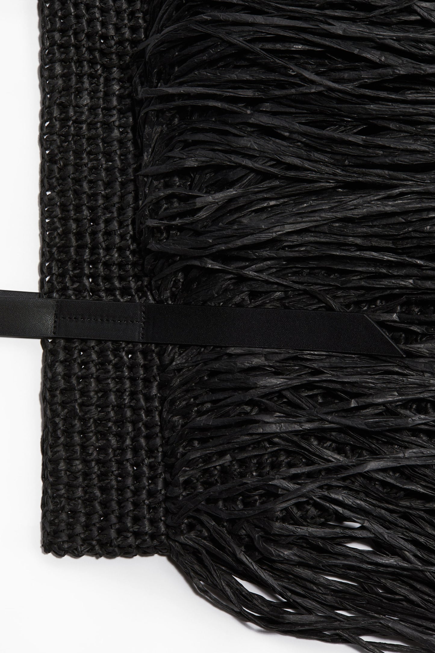 Fringed straw handbag