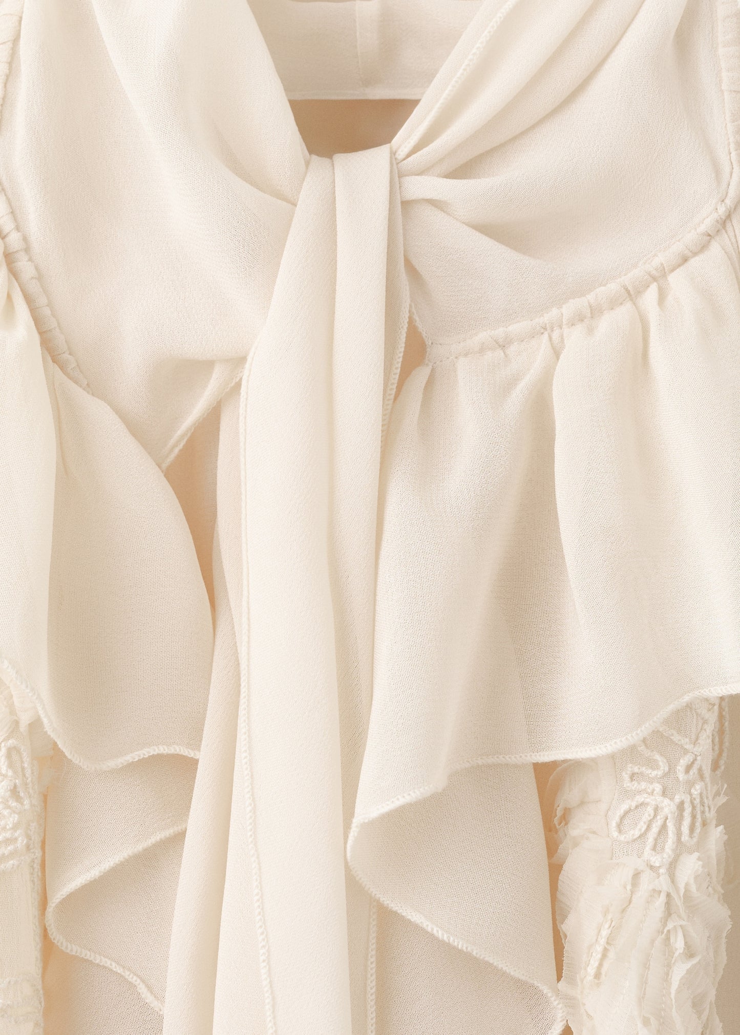 Ruffled blouse with bow neck