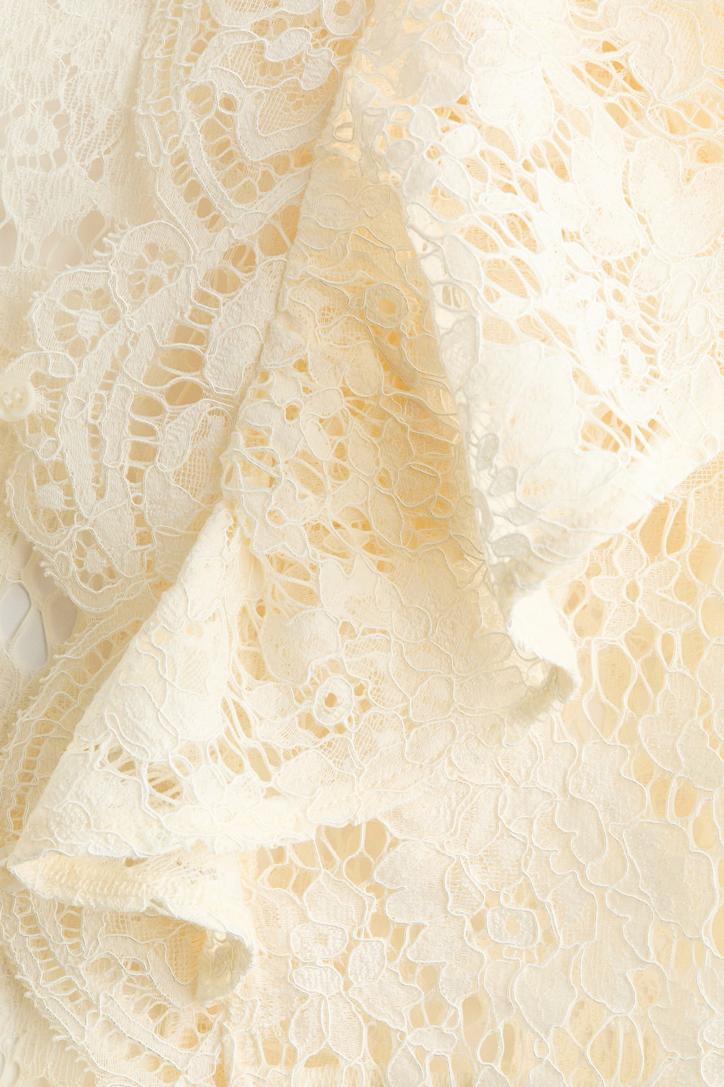 Flounce-trimmed lace blouse