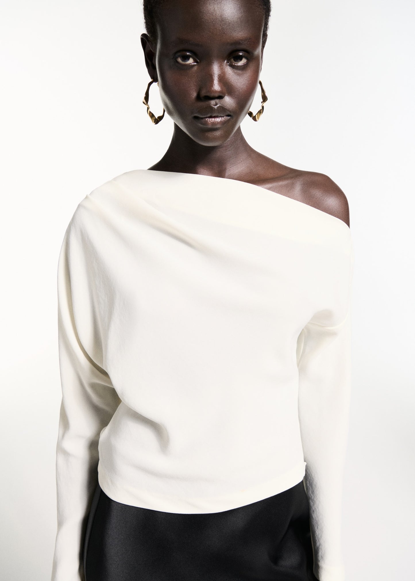 Asymmetrical blouse with pleat detail