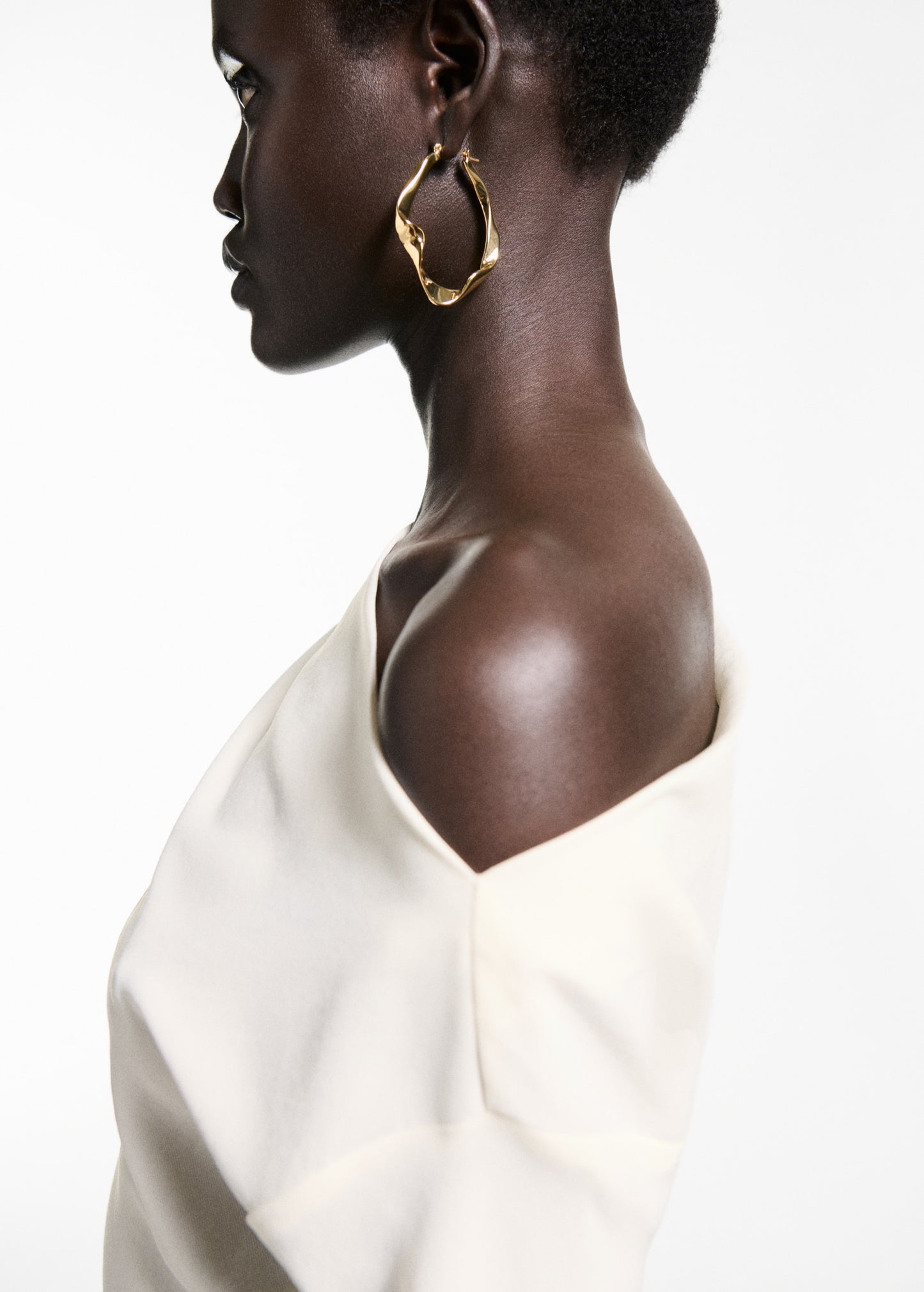 Asymmetrical blouse with pleat detail