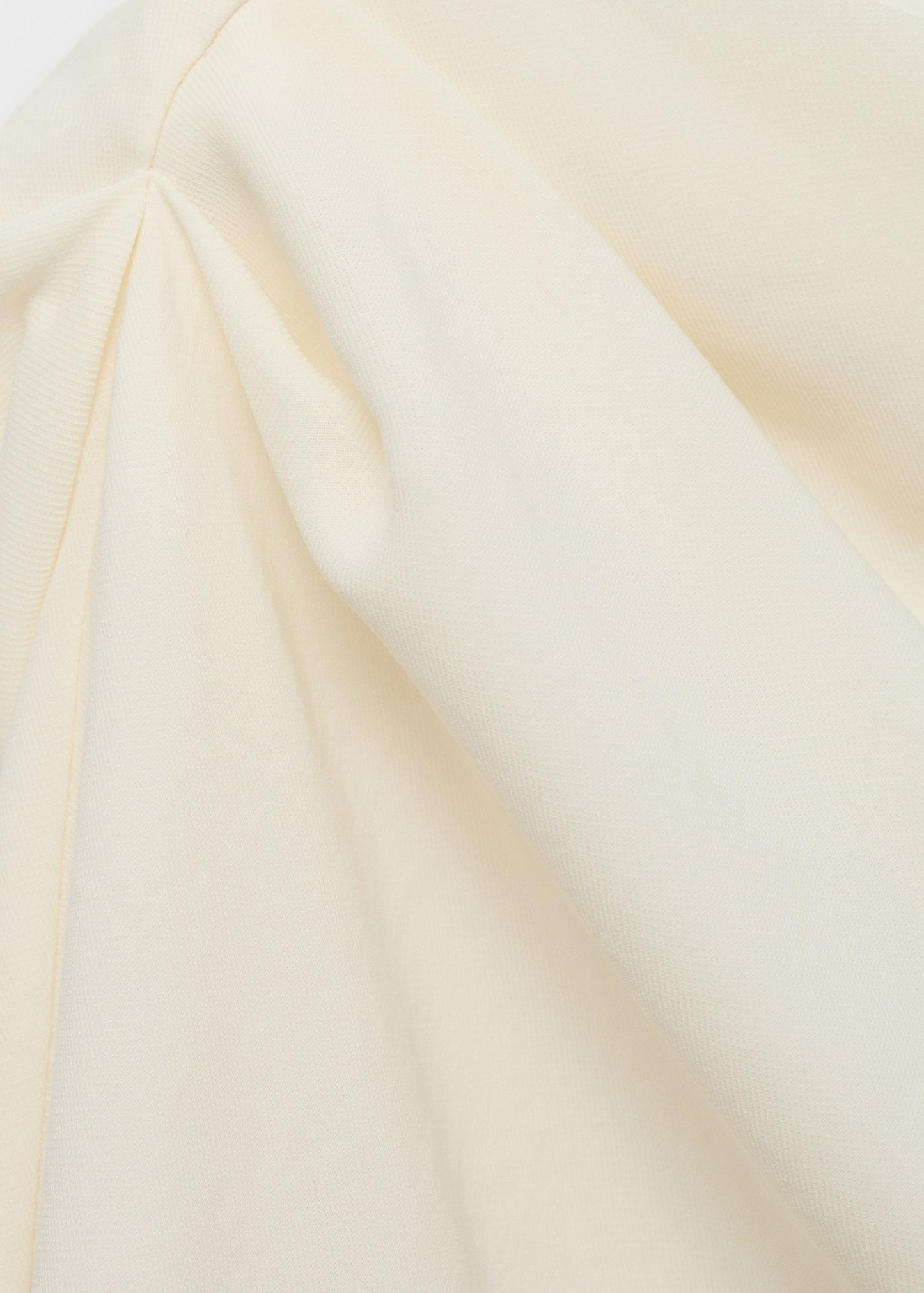Asymmetrical blouse with pleat detail