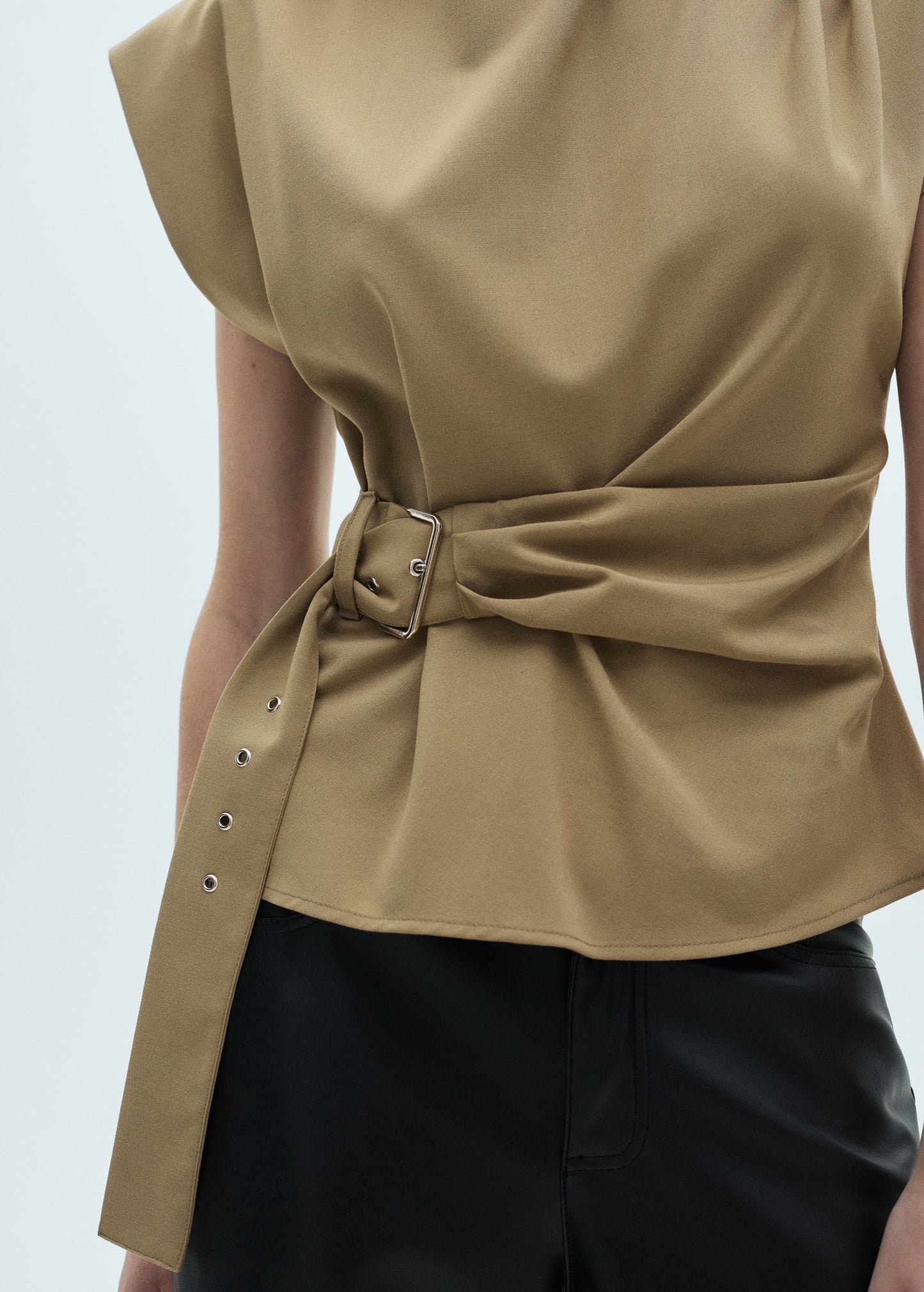 Blouse with shoulder pads and belt