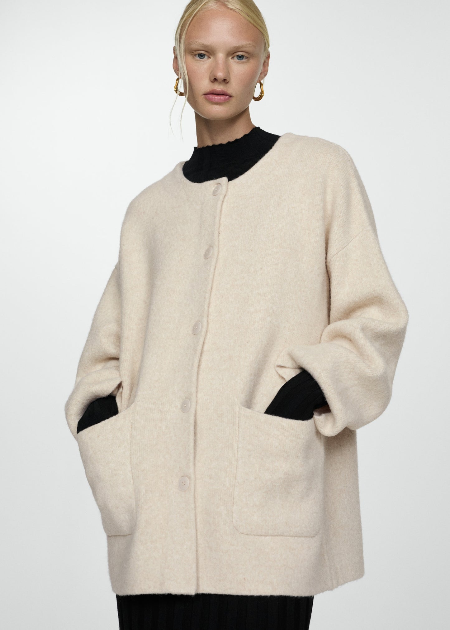Knitted coat with detachable scarf