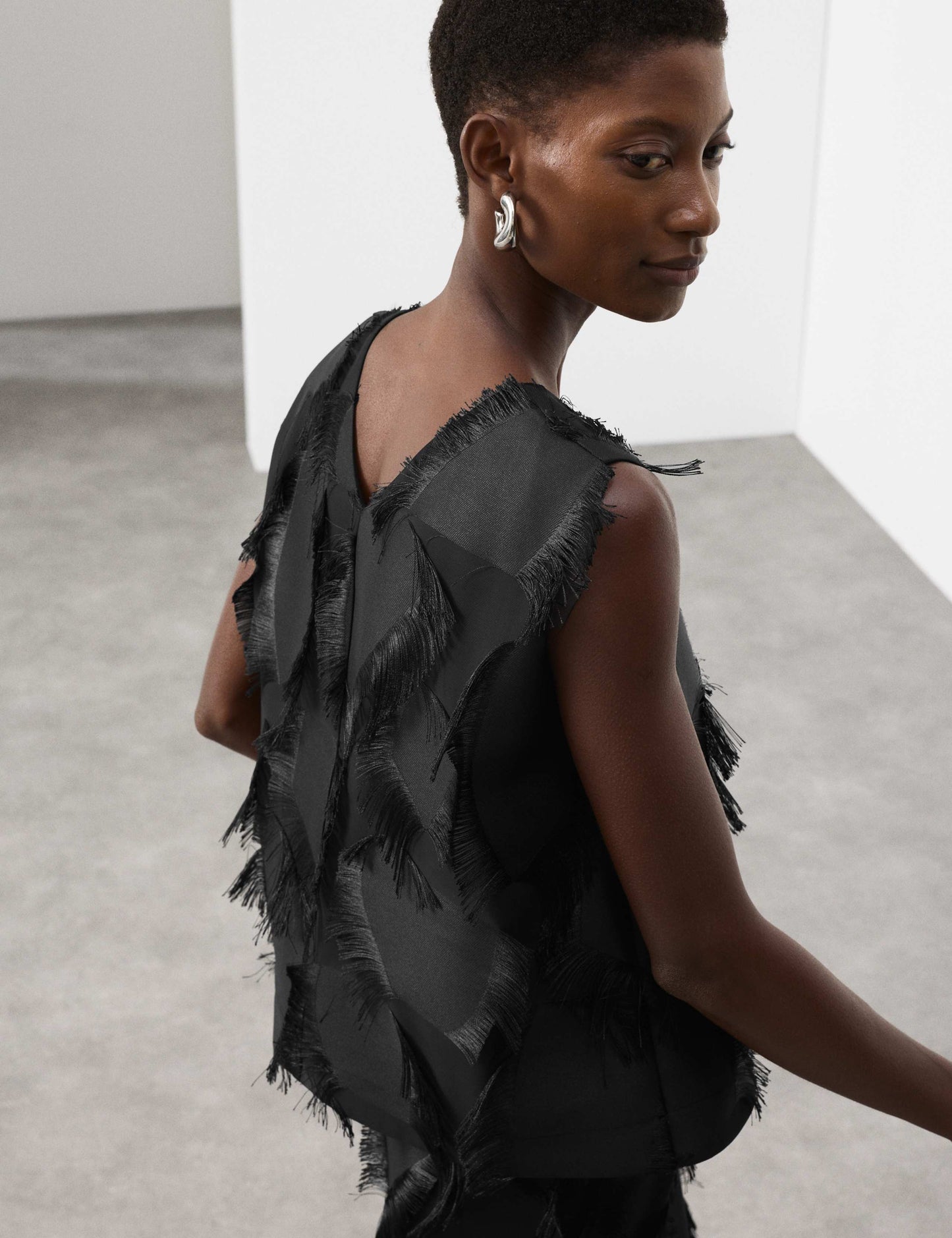 Relaxed Fringe Twist Back Detail Top