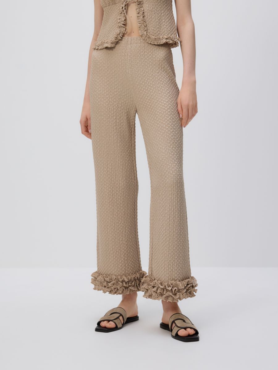 Trousers with ruffle detail