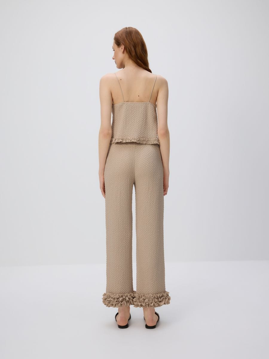 Trousers with ruffle detail