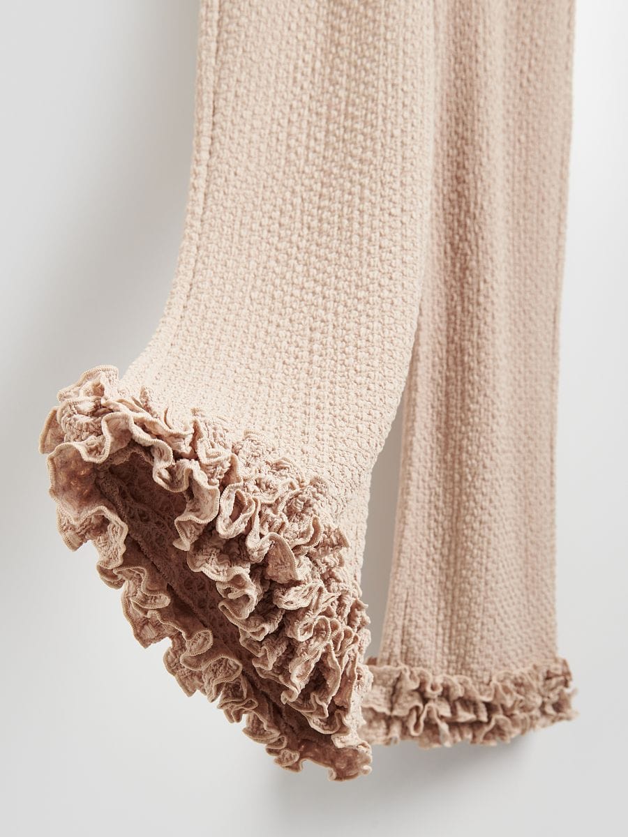 Trousers with ruffle detail