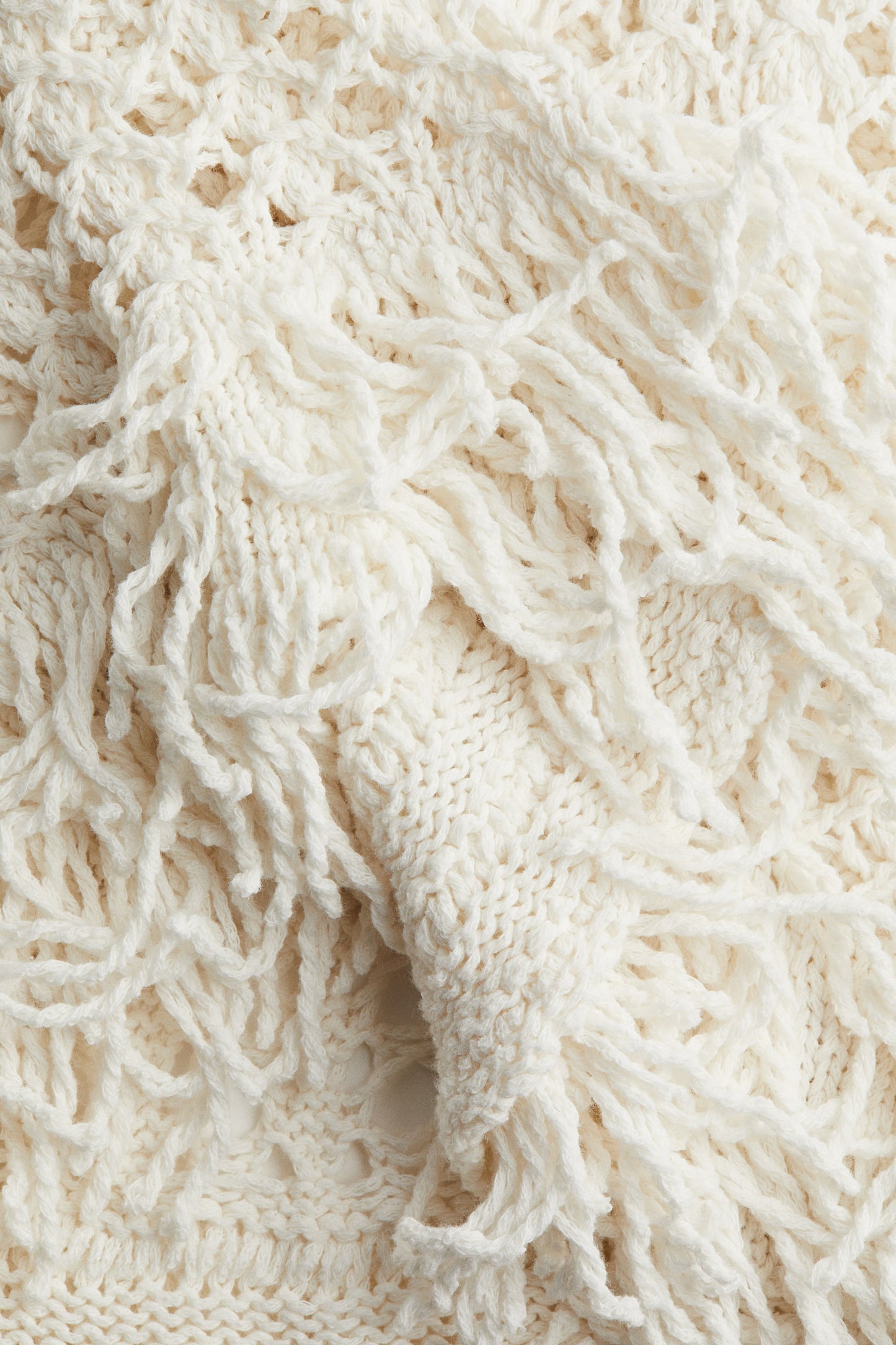Fringe-trimmed hole-knit dress