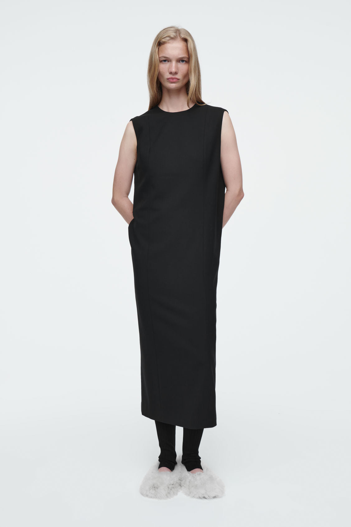The sleeveless tailored wool dress