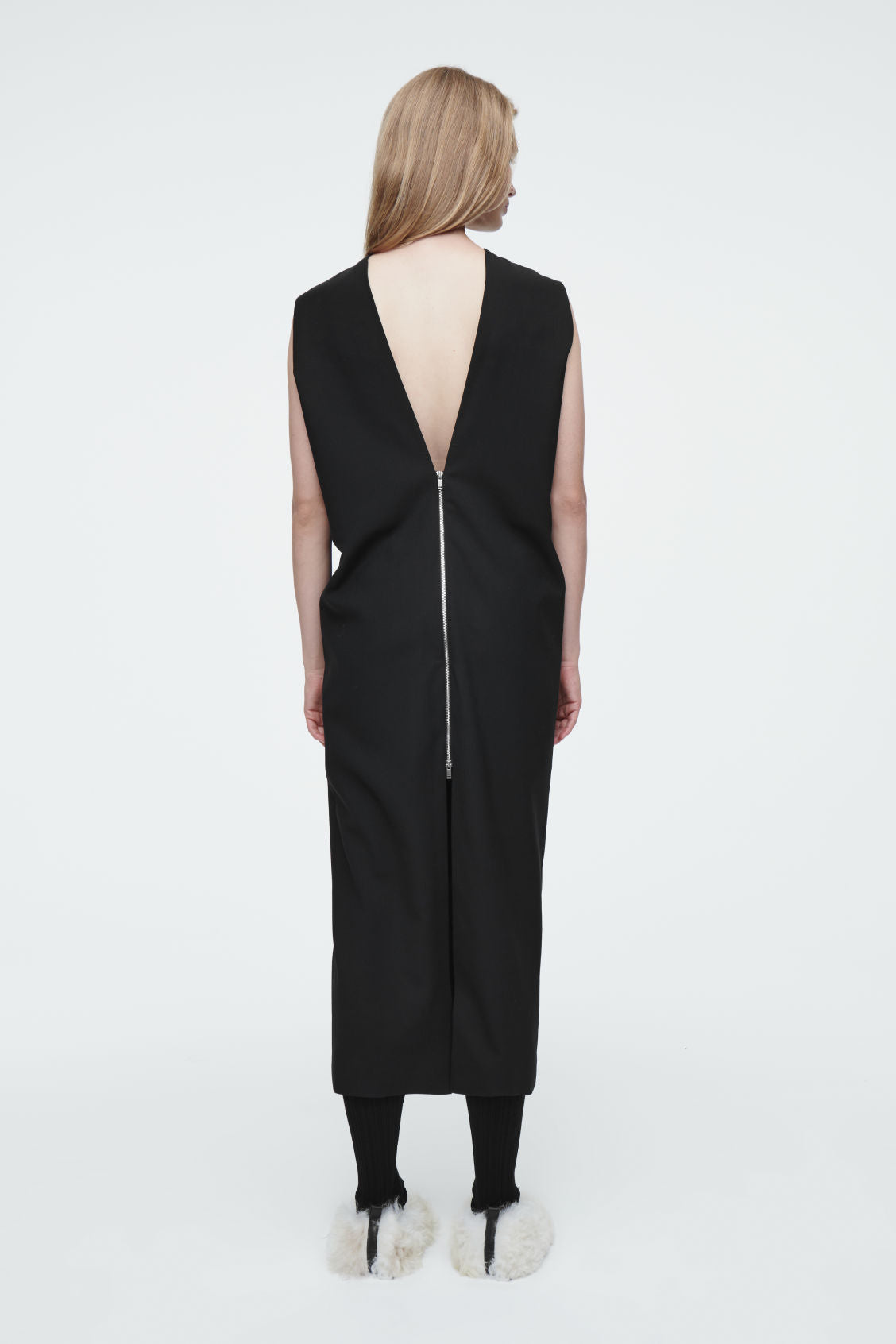 The sleeveless tailored wool dress