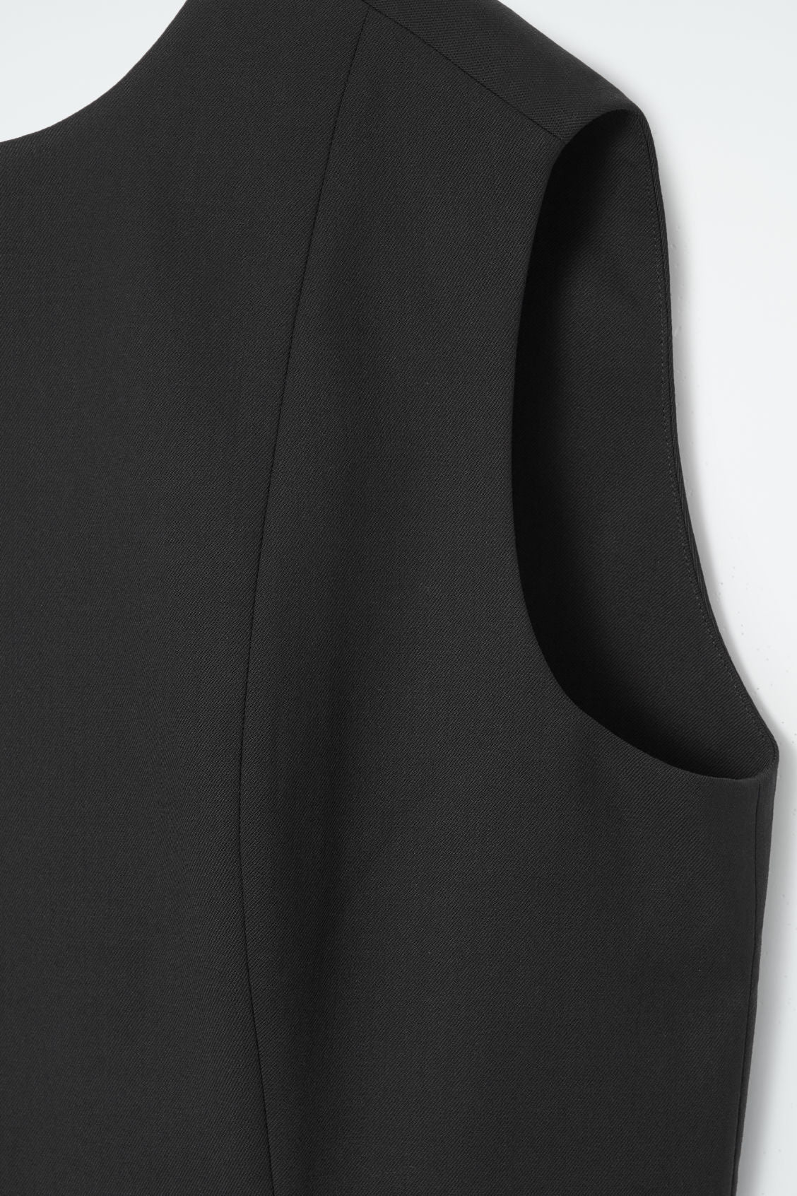 The sleeveless tailored wool dress
