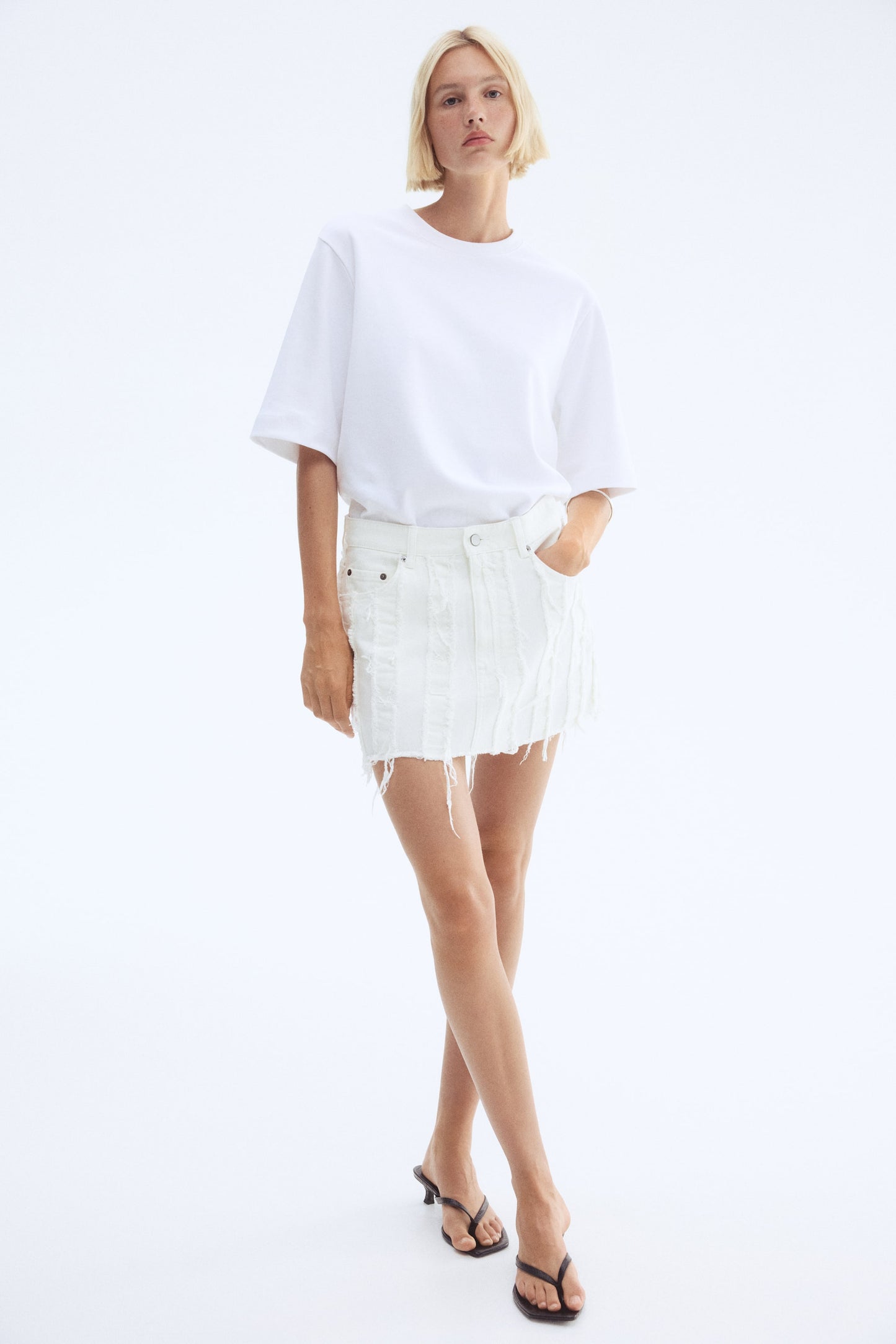 Frayed denim mini skirt