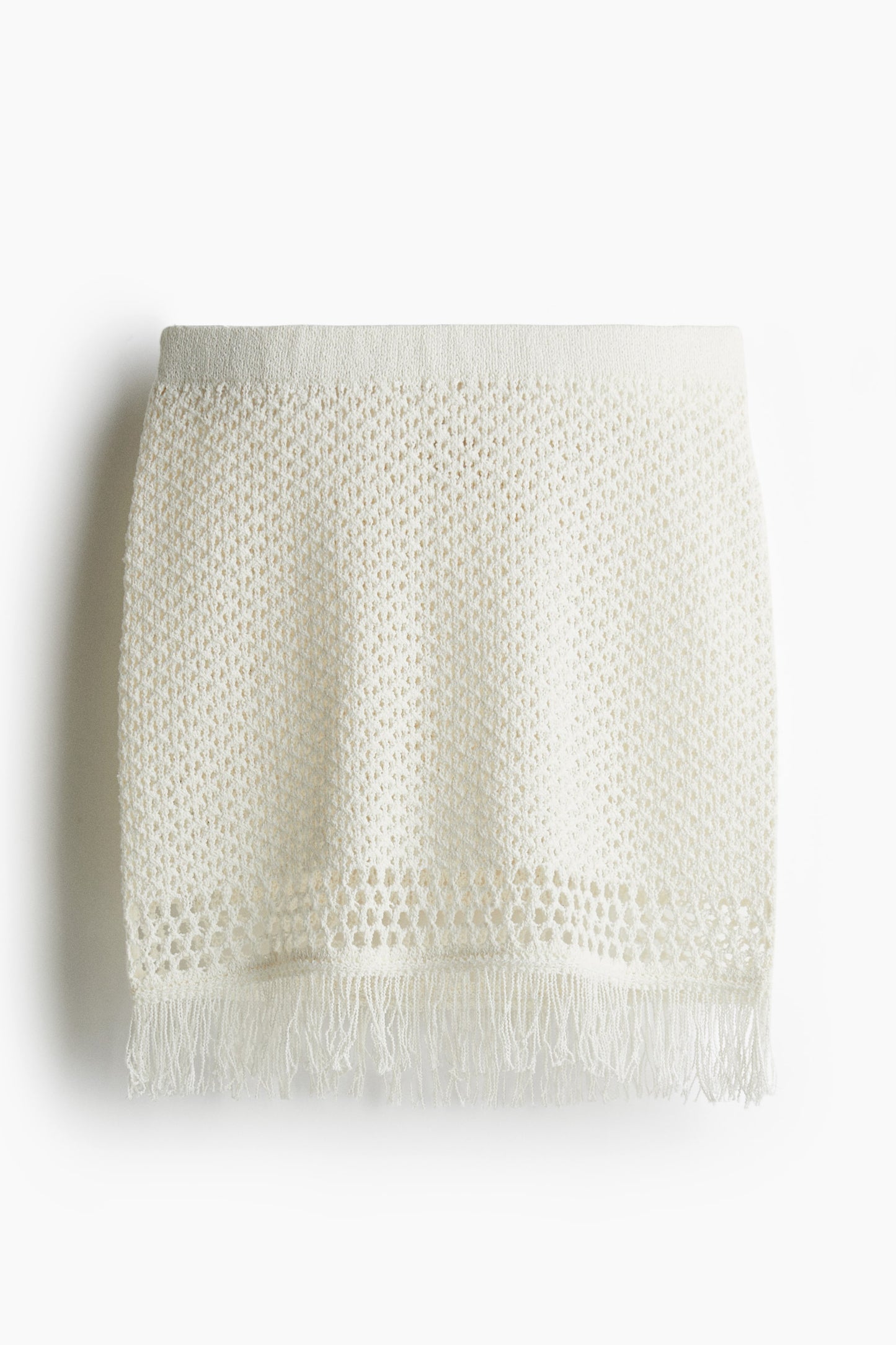 Fringe-trimmed pointelle-knit skirt