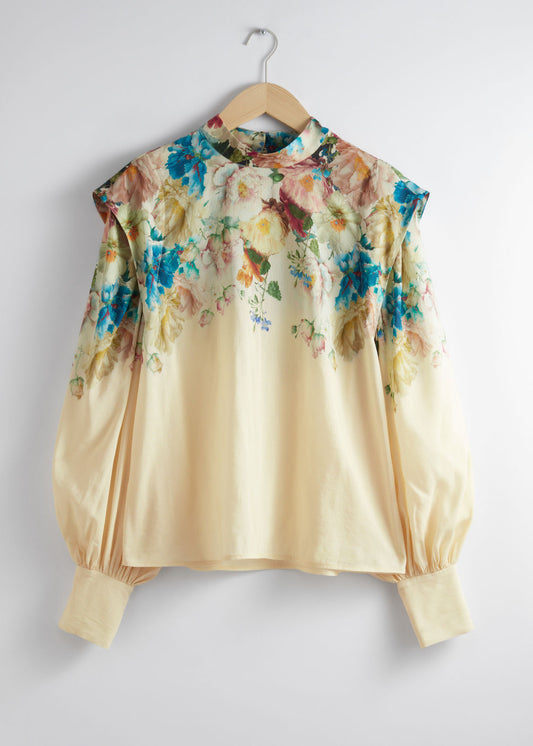Extended-shoulder floral blouse