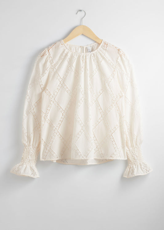 Embroidered frill-cuff blouse