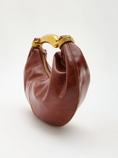 Handbag with metal handle