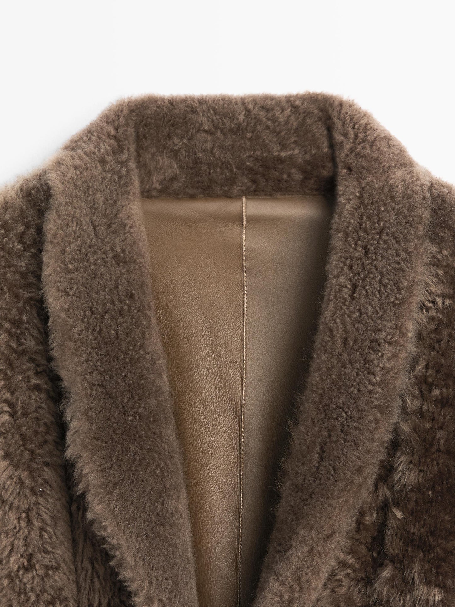 Long mouton coat with belt