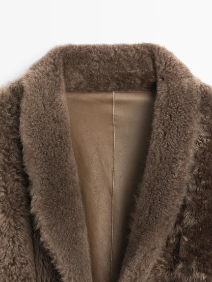 Long mouton coat with belt