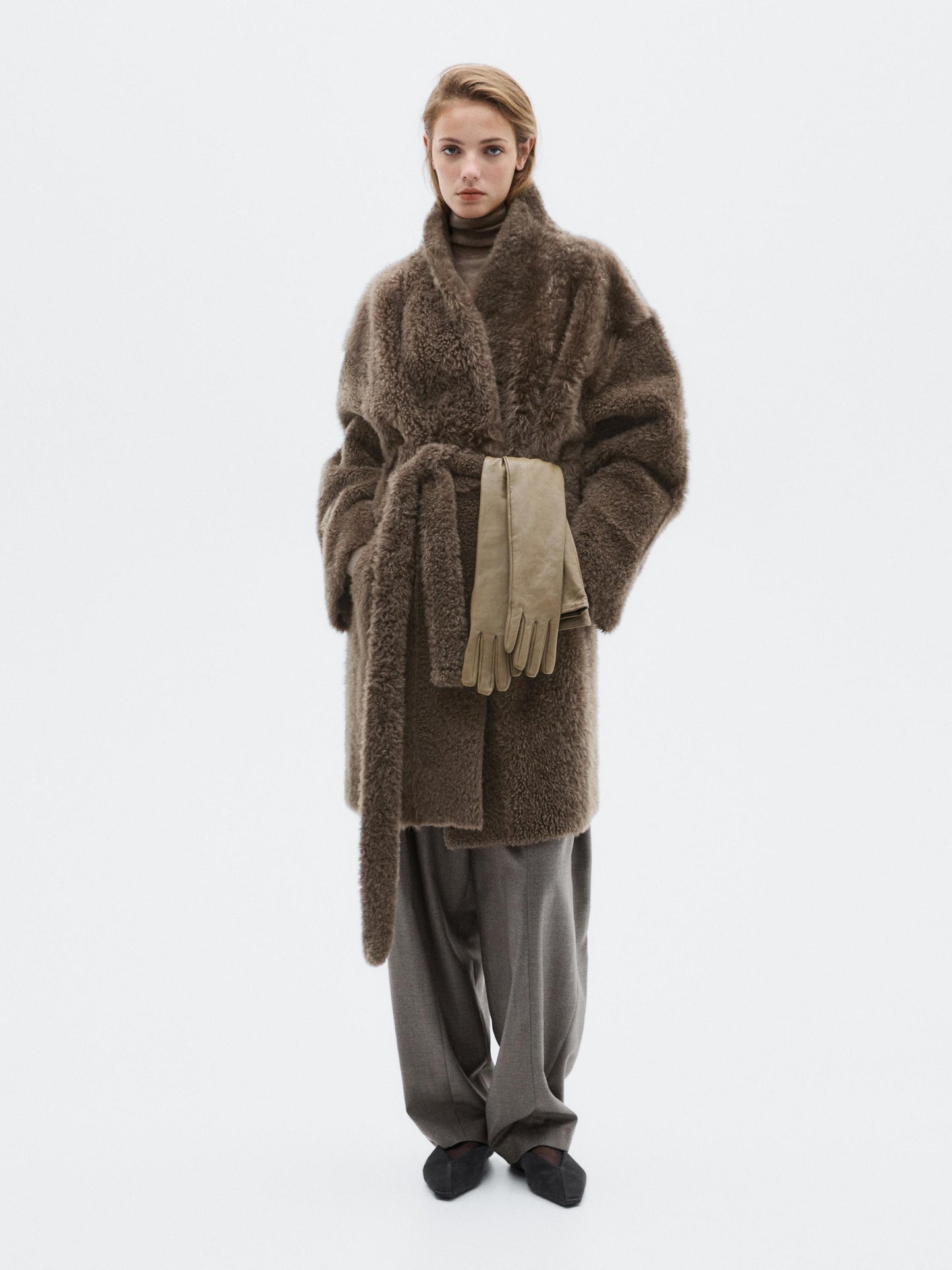 Long mouton coat with belt