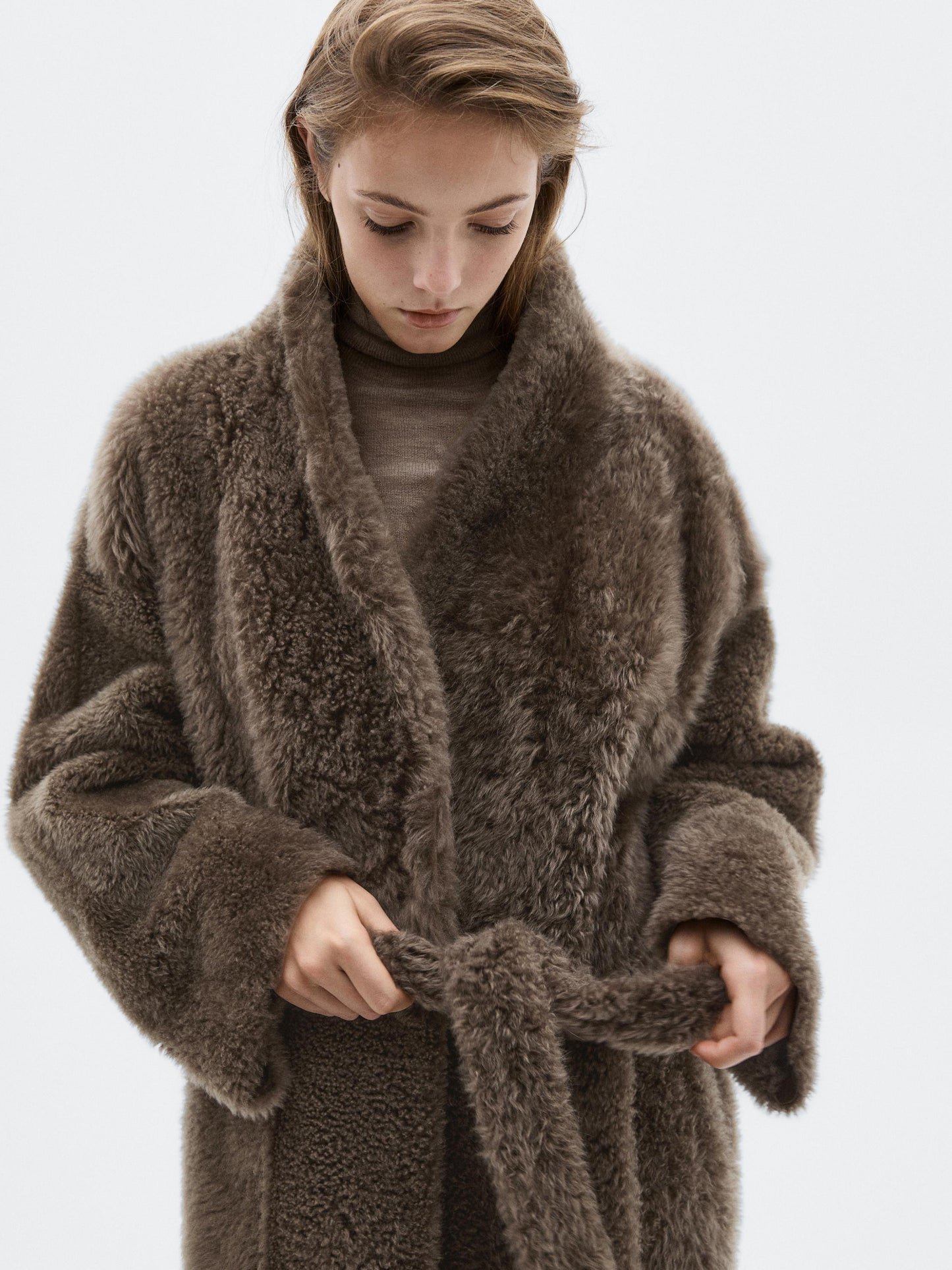 Long mouton coat with belt