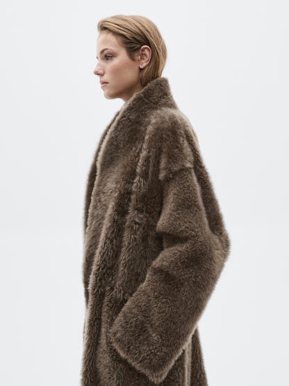 Long mouton coat with belt